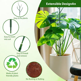Sturdy green stakes that support climbing plants in pots.