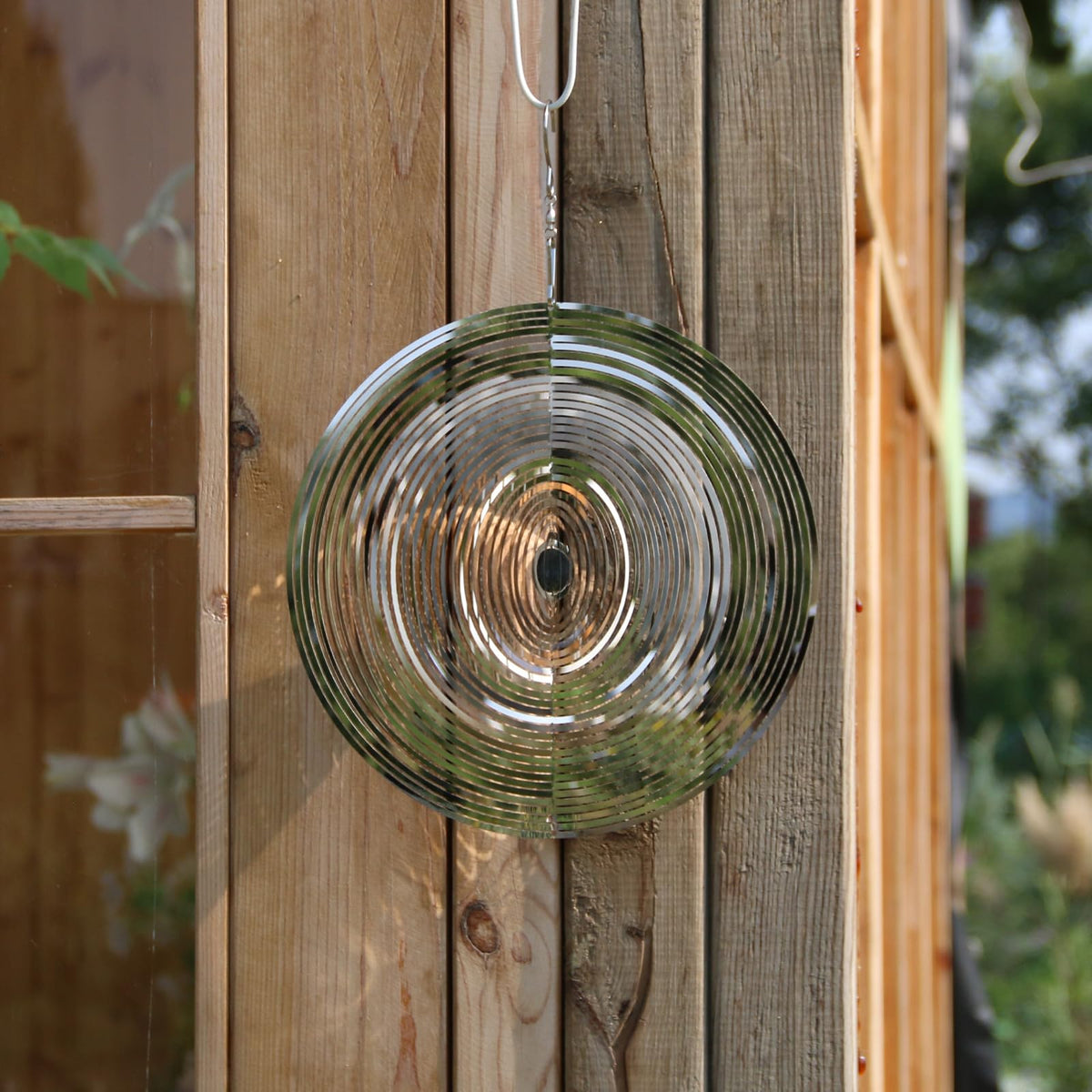 Phuryllic wind spinner round breeze action demonstrates kinetic movement outdoors.