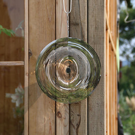 Phuryllic wind spinner round breeze action demonstrates kinetic movement outdoors.