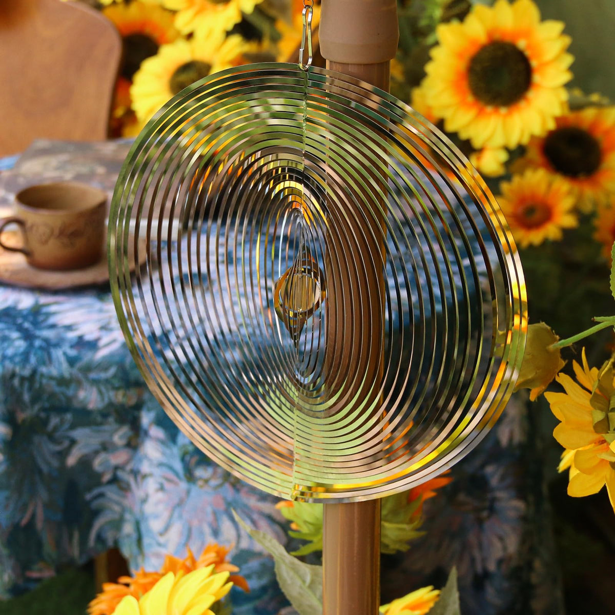 Phuryllic wind spinner round detail metal highlights sun-catch reflections.
