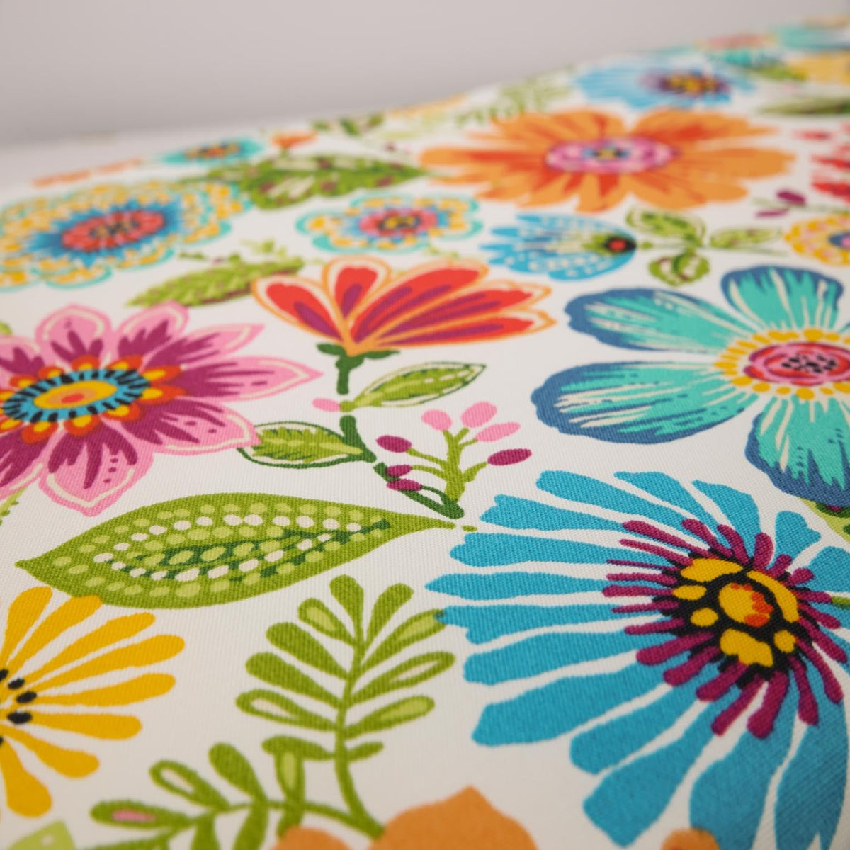 Pillow Perfect water- and fade-resistant fabric protects the fill outdoors