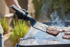 PIT BOSS Griddle Cleaning Brush with replaceable pad for thorough cleaning.