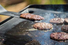 PIT BOSS Spatula with built-in bottle opener for on-hand refreshment.