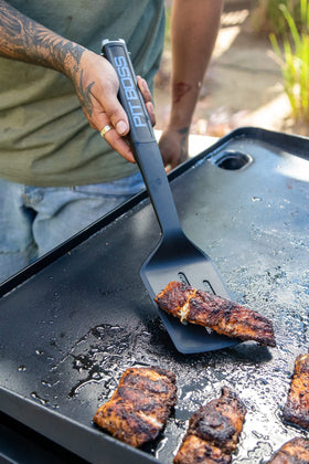 PIT BOSS Ultimate Griddle Scraper for fast debris removal and cleanup.