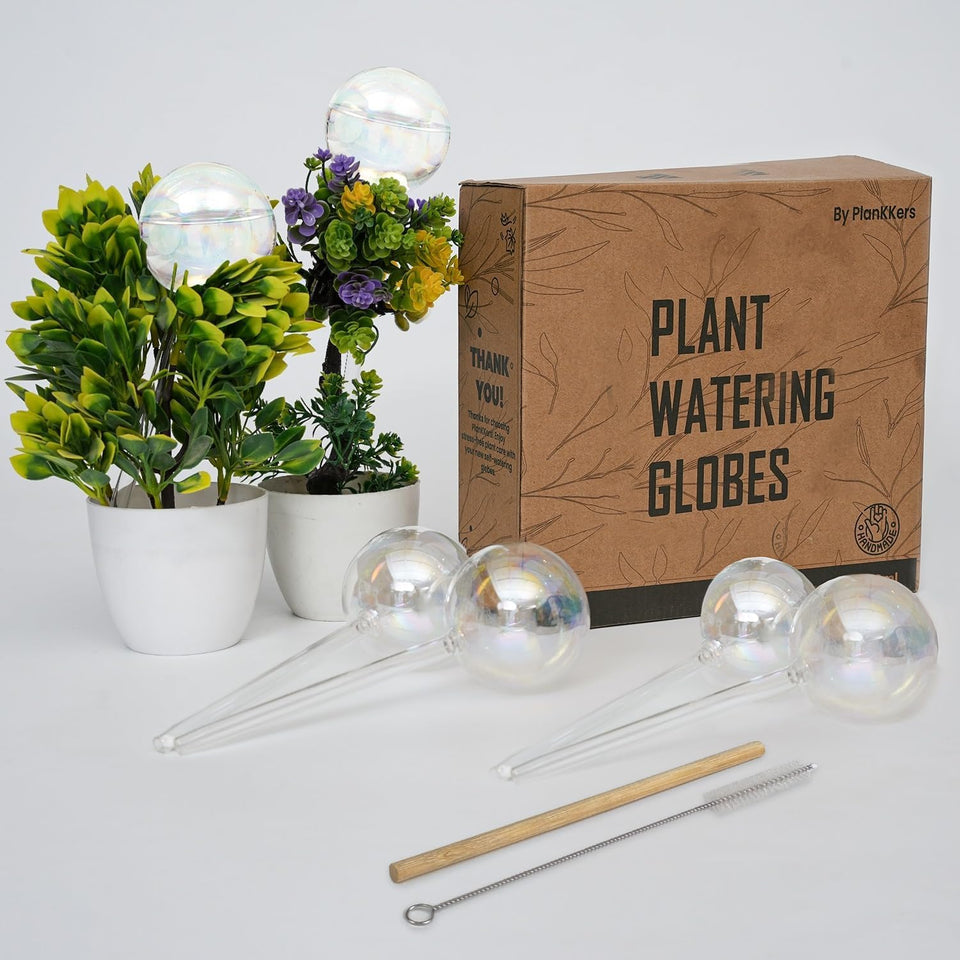 PlanKKers iridescent self-watering globes hydrate indoor plants with even moisture.