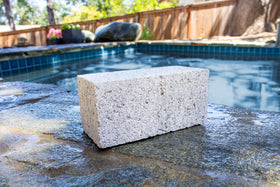 Poolmaster pumice stone cleans tile, grout, and concrete to remove mineral stains.