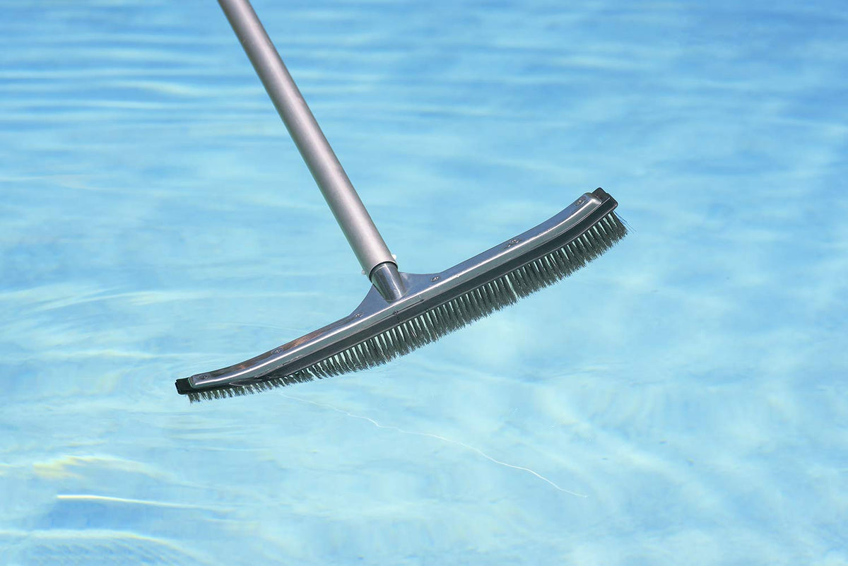 Poolmaster wide head cleaning walls and floors across a large pool area.