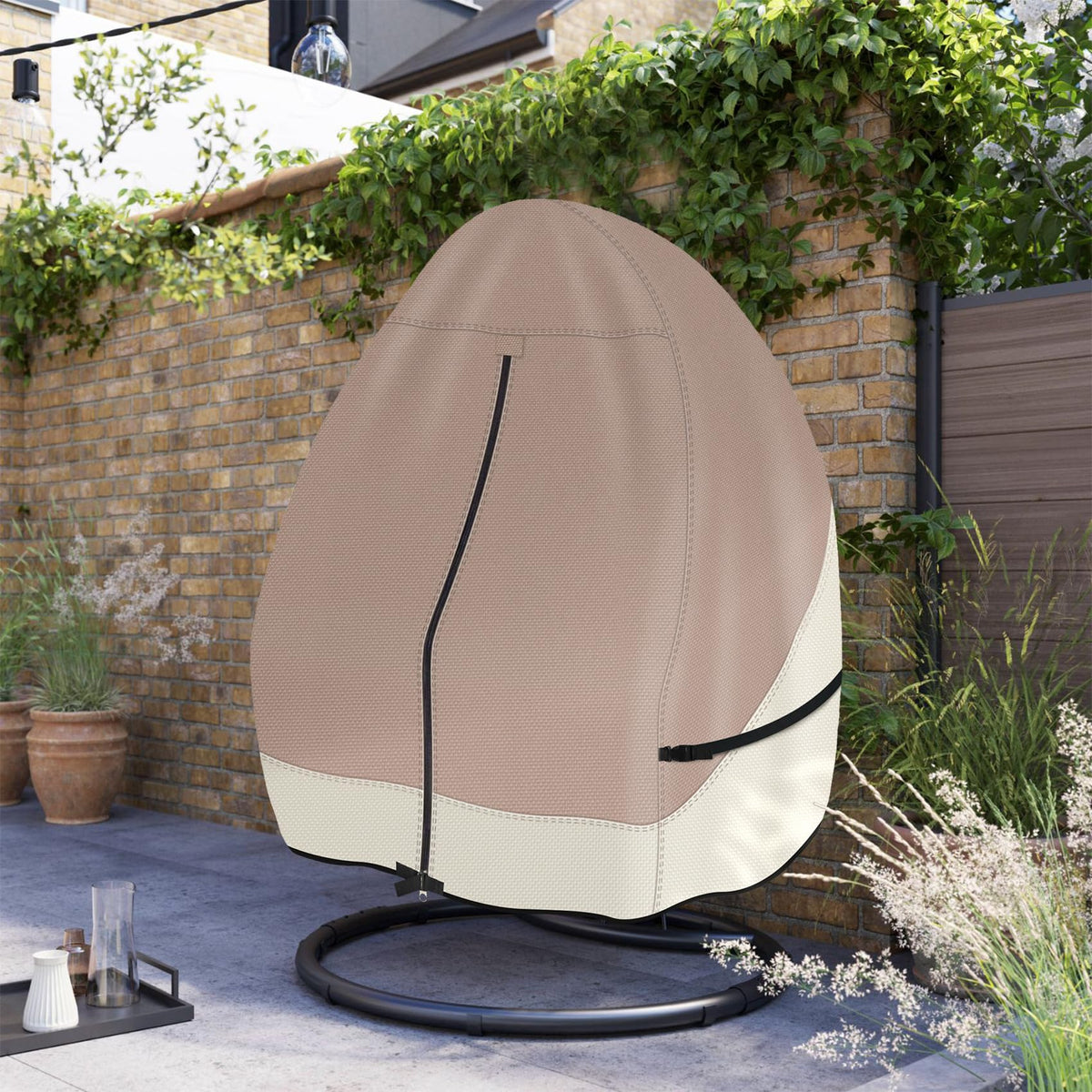 Outdoor protection from Porch Shield for double-seat wicker egg chair on a patio