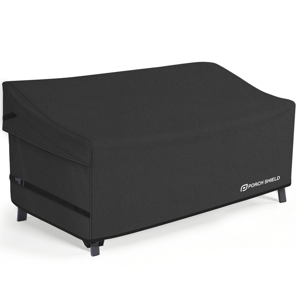 Porch Shield waterproof outdoor sofa cover on a 3-seat couch protecting from rain and sun.