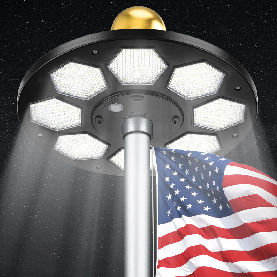 PPQ solar flagpole light with 160 LEDs illuminating the flag at night for clear visibility.