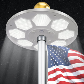 PPQ 160-LED solar flagpole light illuminating a flag at night for clear visibility