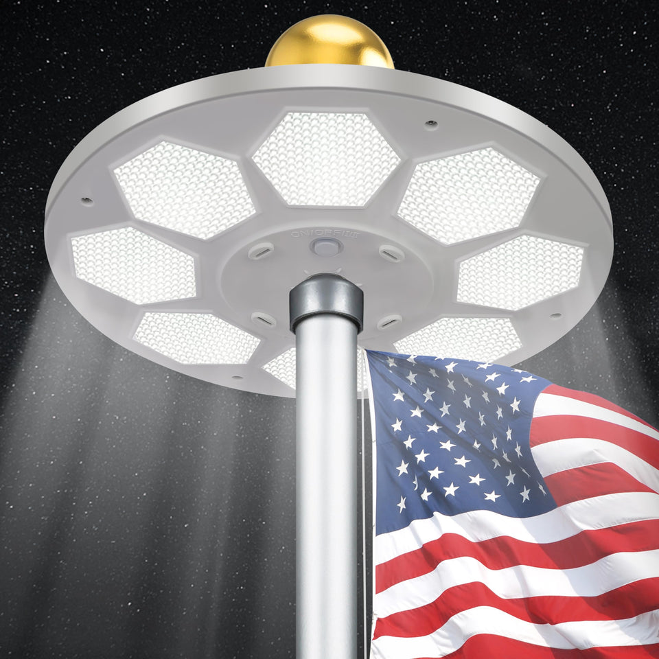 PPQ 160-LED solar flagpole light illuminating a flag at night for clear visibility
