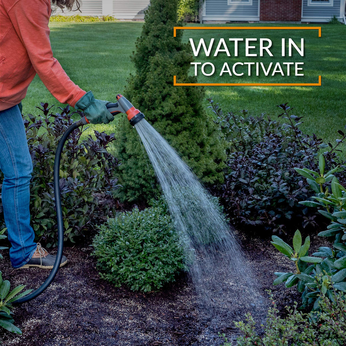 Preen Extended Control Weed Preventer protecting shrubs and trees around a border