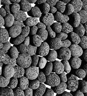 Premium Pebbles lava rocks close-up texture for fire pits
