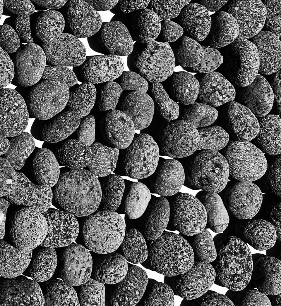 Premium Pebbles lava rocks close-up texture for fire pits