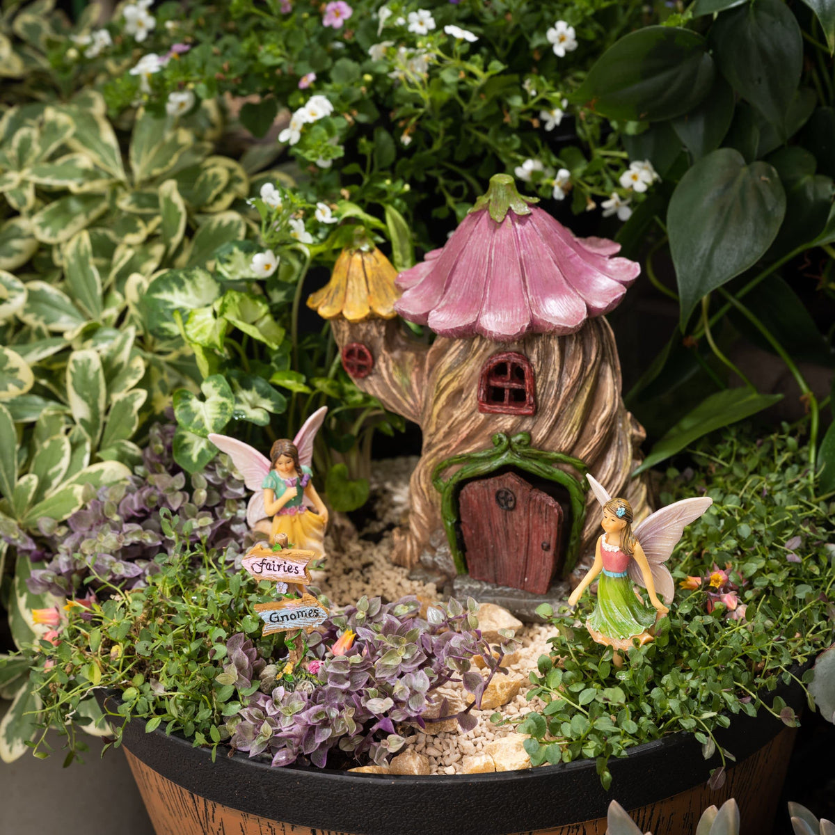 PRETMANNS Container garden display brings playful fairy elements to a balcony.