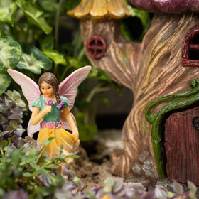 PRETMANNS Fairy garden setup detail highlights durable finishes and tiny accessories.