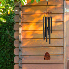 PRSTENLY wind chimes hung on a porch ready for a breeze