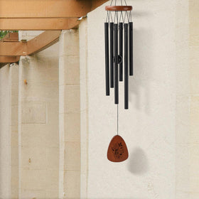 PRSTENLY wind chimes on a porch create relaxing sounds during evenings.