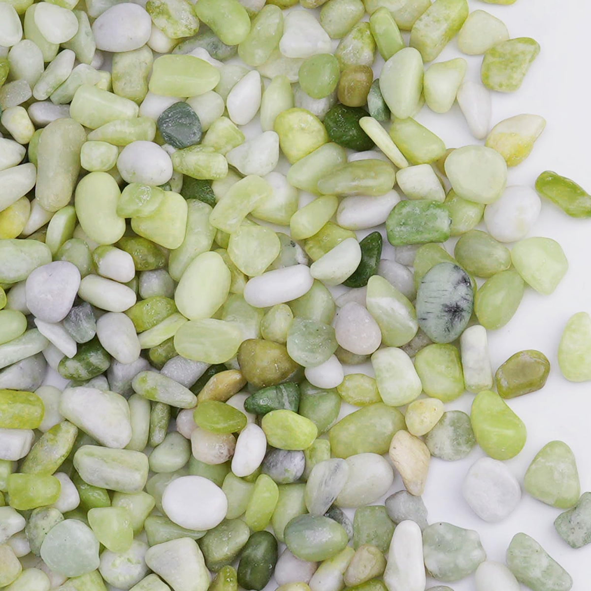 Pulovin jade pebbles close-up with a polished surface for bright displays