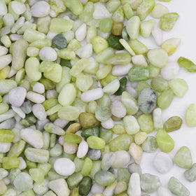 Pulovin jade pebbles close-up with a polished surface for bright displays