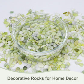 Pulovin jade pebbles as vase filler creating a polished background