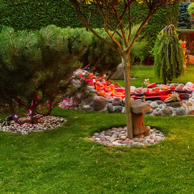 Pulovin river rocks pots and planters accent for large container plantings.