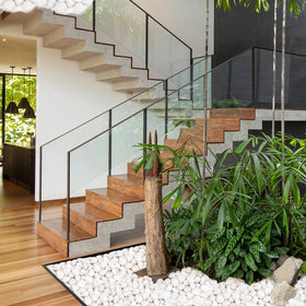 Pulovin white stones accenting a landscaped yard and flower bed