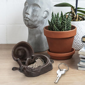 Pumtus decorative snail key holder enhances home decor.