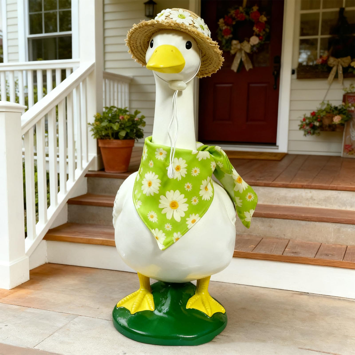 Pwefopessc goose straw hat adds warm charm to garden statues.