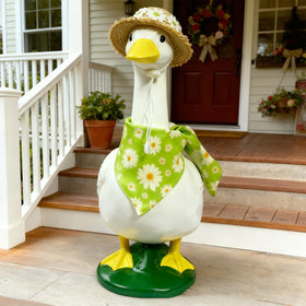 Pwefopessc goose straw hat adds warm charm to garden statues.