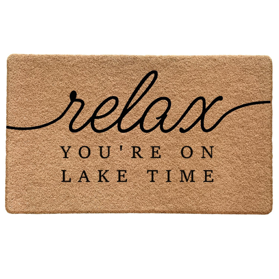 Qabliqo Lake House Door Mat at the front door with nautical welcome design traps dirt.