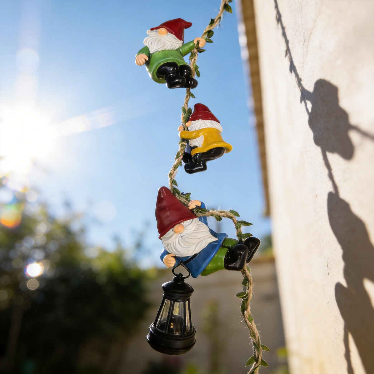 QCF resin gnome figures with vibrant outfits add lifelike charm to outdoor spaces