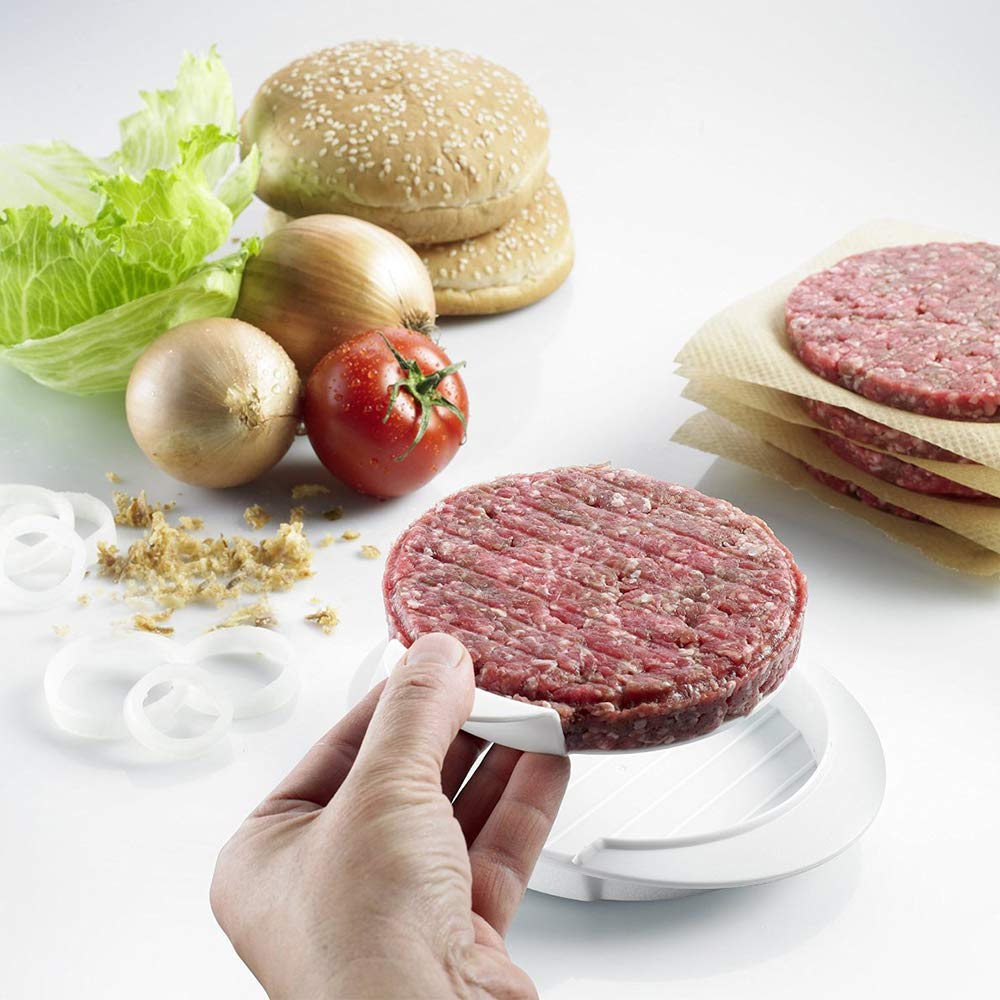 Hands shaping beef patty using QELEG mold for uniform thickness
