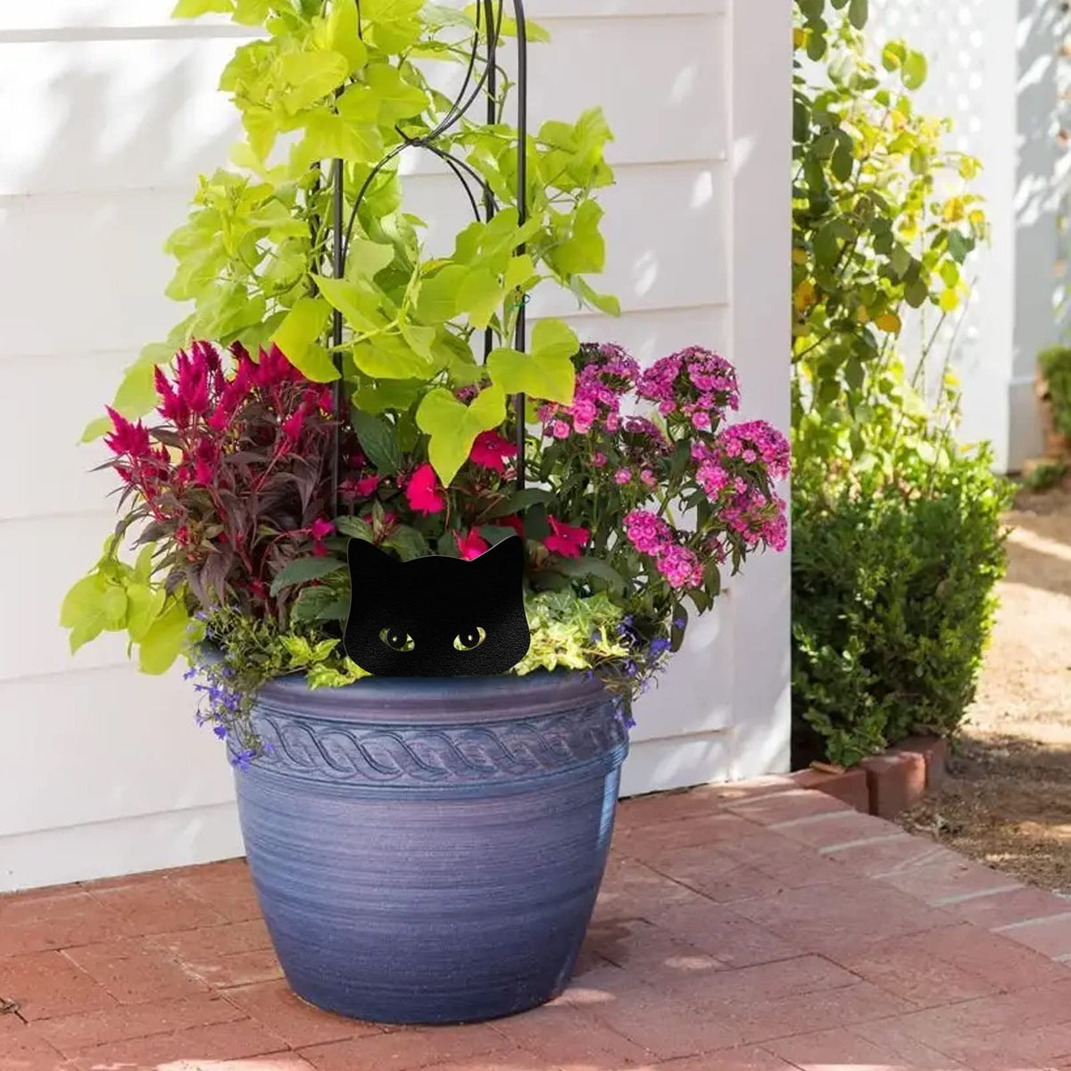 Qmetalart peeping cat garden ornament enhances entryways and borders.