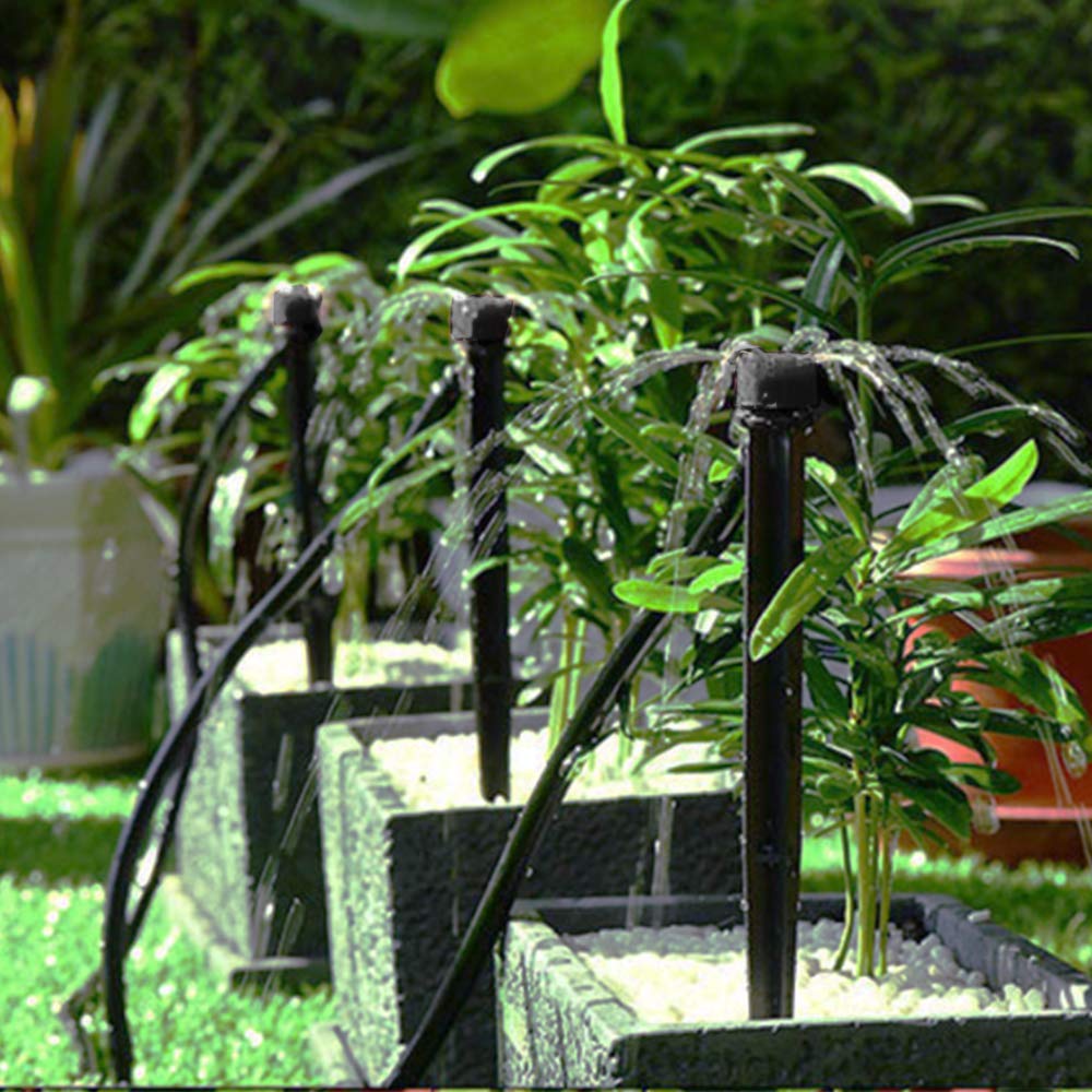 QMOEH soil-insert emitter shown in soil for root-zone watering