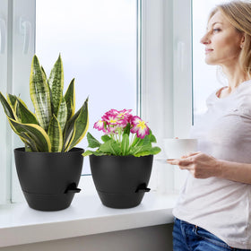 QRRICA matte black planter set with drainage and reservoir.