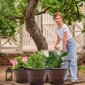 Quarut 12-inch pot with saucer keeps surfaces clean and dry.