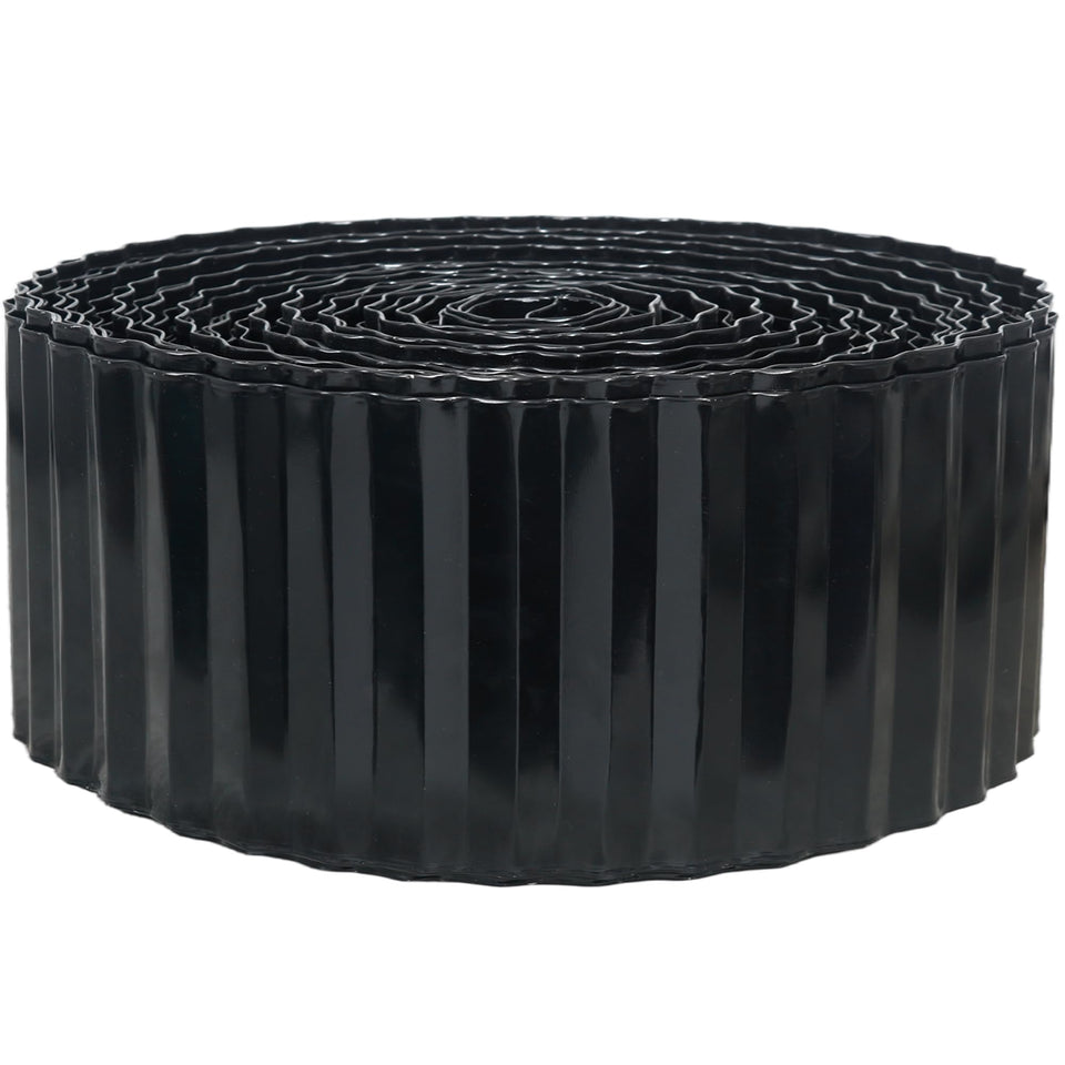 Quibbay corrugated metal edging along a lawn creates a clean black 4-inch border for a tidy lawn edge.