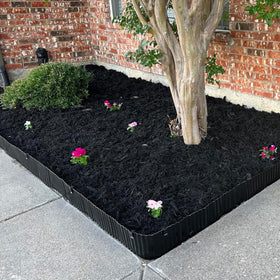 Quibbay black 4-inch edging complements contemporary landscape designs.