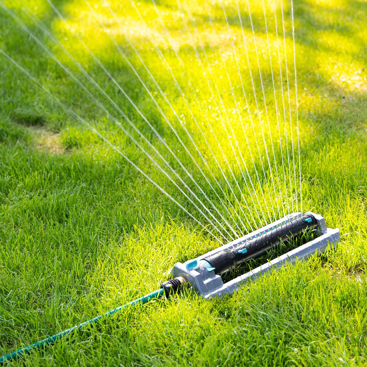 The QUOBAS sprinkler suits lawns, gardens, and driveways for versatile watering.