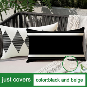 Black and beige Boho lumbar cover adds subtle texture outdoors.