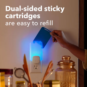 Raid Essentials light trap in living room setup for quiet pest control.