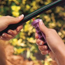 Rain Bird DRIPKITBAG tubing stakes with bug caps; secure soil placement.