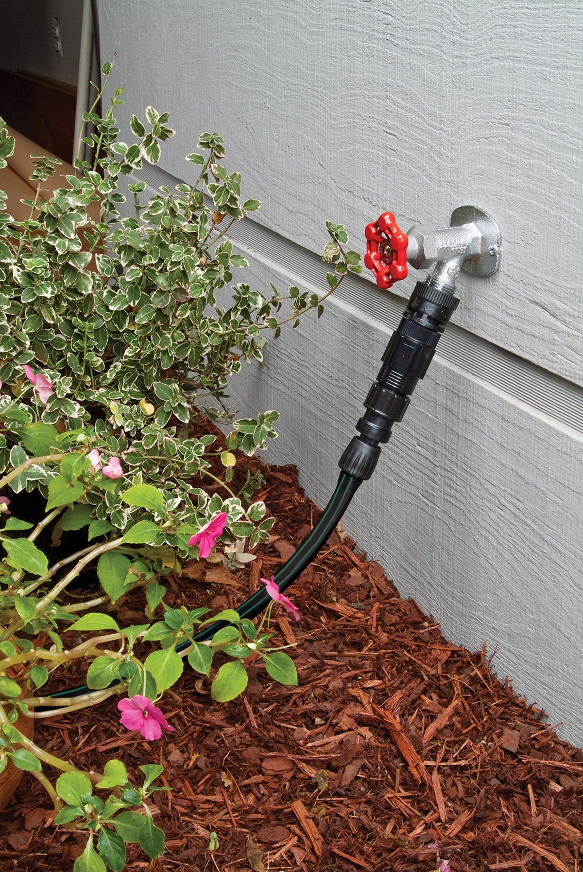 Rain Bird FCKIT-1PK mounted on faucet demonstrates easy, leak-proof connection.