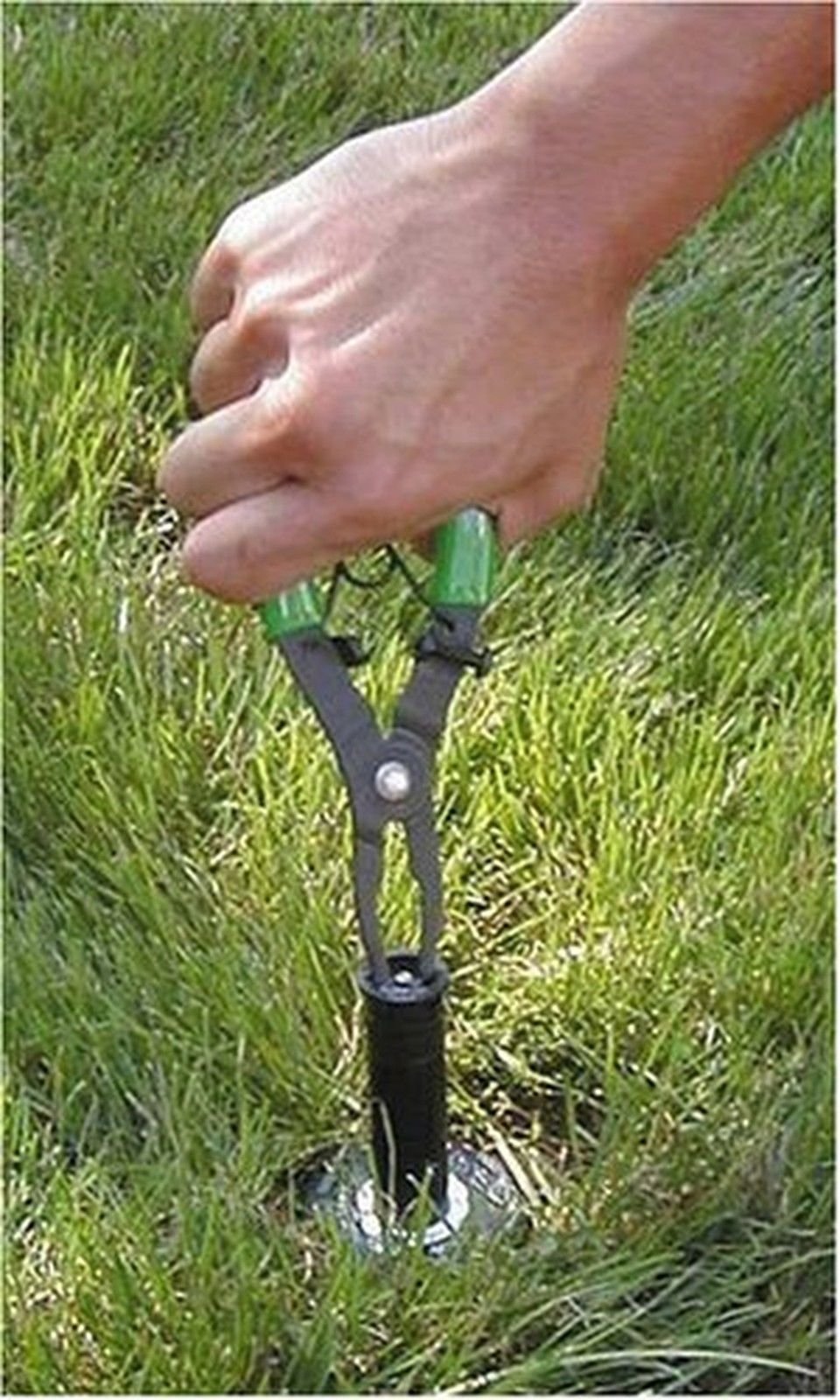 Rain Bird PTC1 tool in use demonstrating stem elevation for hands-free maintenance of pop-up sprinklers.