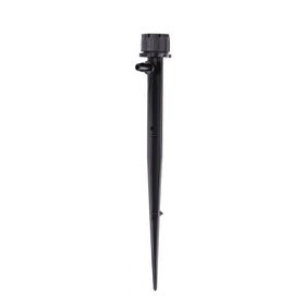 Raindrip adjustable flow bubbler on stake delivering customizable garden watering.