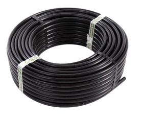 Raindrip supply tubing main line delivering water to garden beds