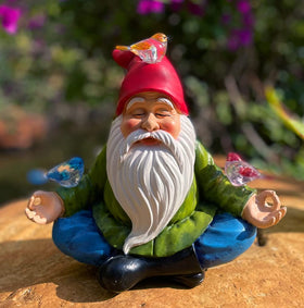 RAYWER rechargeable solar battery powers the gnome's light at dusk.