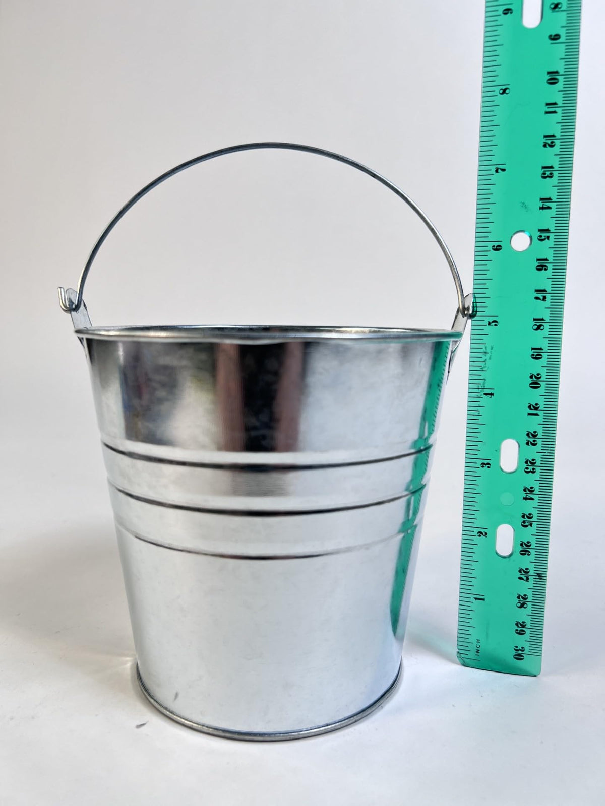 Regent galvanized metal buckets used as wedding centerpieces for rustic decor.
